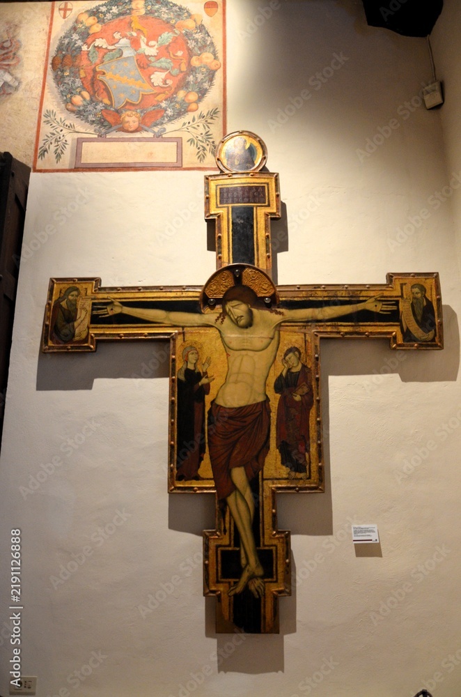 Obraz premium San Gimignano, Italy 03.04.2020: Painted crucifix by Maestro di Varlungo