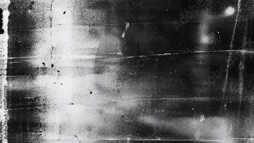 Dark monochrome vintage film texture featuring blurred light leaks, horizontal streaks, dust, scratches, grain, and distressed analog imperfections.
