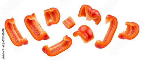 Falling sliced red bell pepper pieces isolated on transparent background