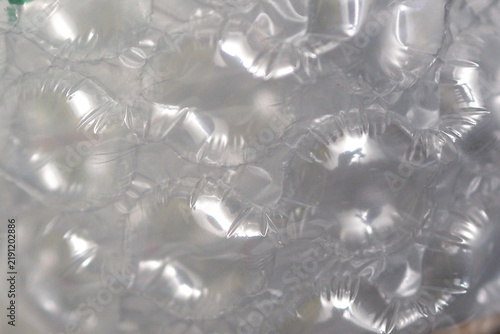 macro photograph displaying the translucent, glossy texture and air bubbles of bubble wrap material.