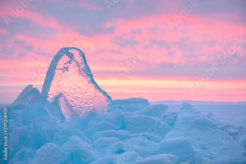 Fotografía Blue transparent ice on Baikal lake at sunrise