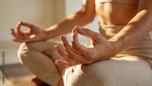 Mindful Woman Practicing Yoga Meditation With Hand Mudra in Warm Natural Light