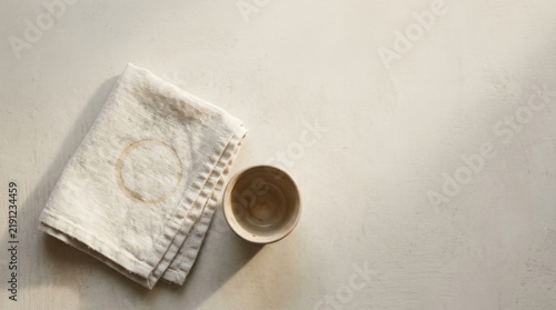 Minimalist Flat Lay of Folded Linen Napkin and Ceramic Espresso Cup