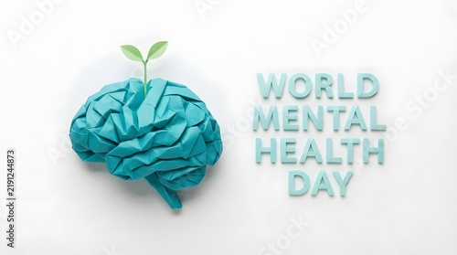 A conceptual studio shot representing world mental health day with a human brain model featuring a small green sprout growing from the top white background