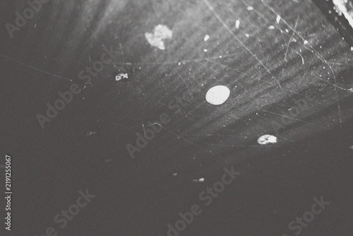 Photography textured surface with scattered white speckles and a few larger, irregular white splotches