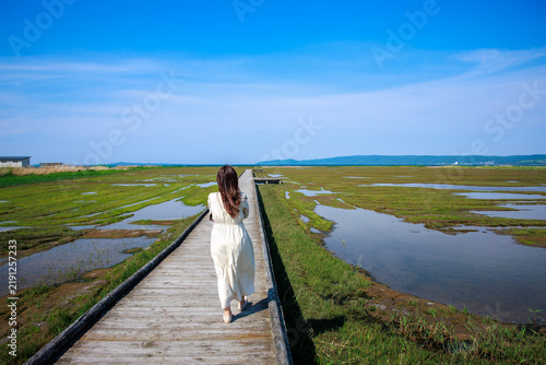 Scenic wooden boardwalk walkway through Tofutsu Lake wetland and marshland in Abashiri, Hokkaido, Japan