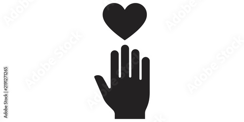 Fotografie Human hand reaching towards floating heart shape for love care concept