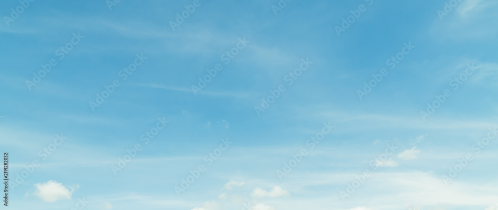 Fototapeta premium the sky is clear blue with fluffy white clouds, the sky is very bright, and the sun shines.