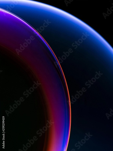 Abstract digital art piece that appears to be a close-up of a curved line or curve. the line is made up of different shades of blue, purple, and orange, creating a gradient effect.