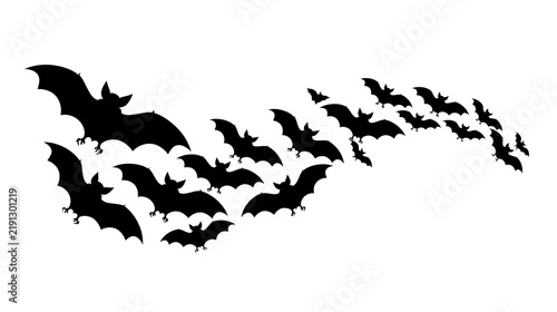 Swarm of black flying bats in silhouette formation
