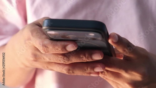 close up of women hand holding smart phone 
