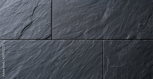 Dark Slate Stone Wall Texture Background Close Up.
