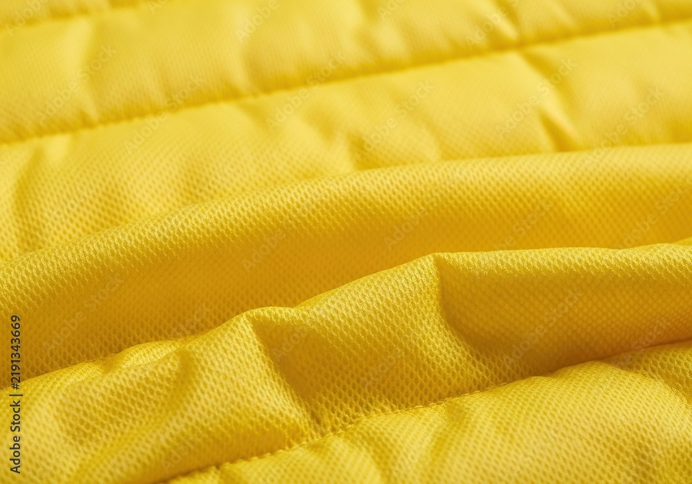 Obraz premium Close up view of bright yellow quilted fabric texture.