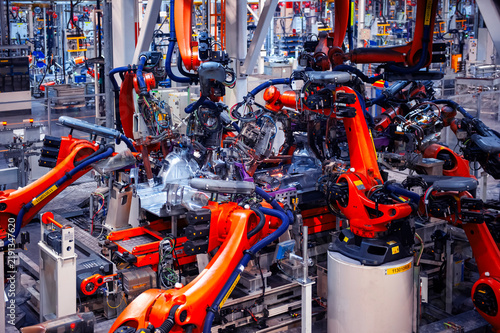 Automated welding robotic arm for automotive factory assembly lines