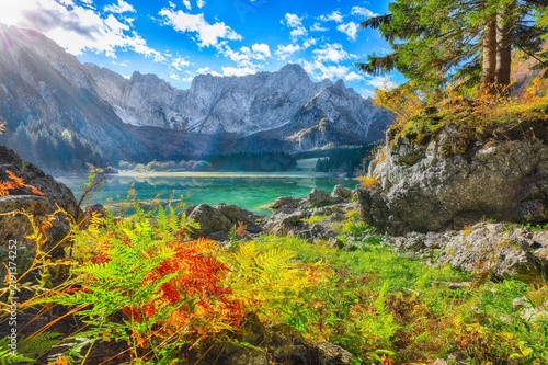 Stunning view of Fusine lake with Mangart peak on background.