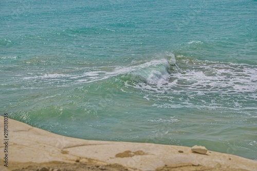 Photography Turquoise sea wave splashing on the shore close up