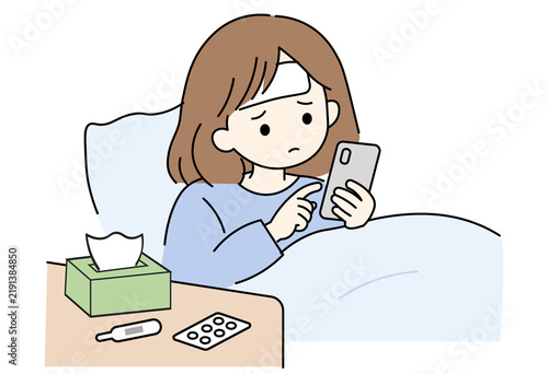 Japanese woman texting her workplace from bed to call in sick due to illness.