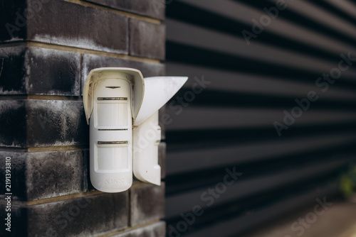 Outdoor motion sensor providing secure home protection