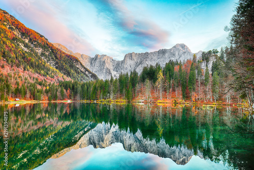 Stunning view of Fusine lake with Mangart peak on background.