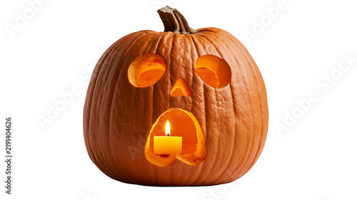 Fotografie Carved orange pumpkin jack-o-lantern with glowing candle inside