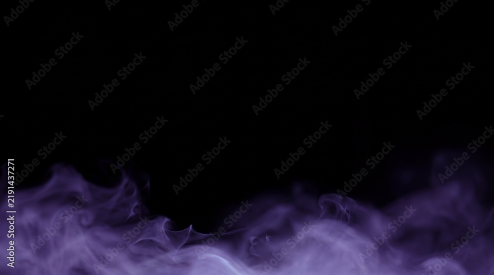 Fototapeta premium A soft purple haze of smoke rising against a solid black background for artistic background with background with background
