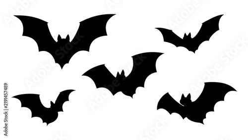 Fotografie Five black bat silhouettes flying in formation, isolated on transparent backgrou
