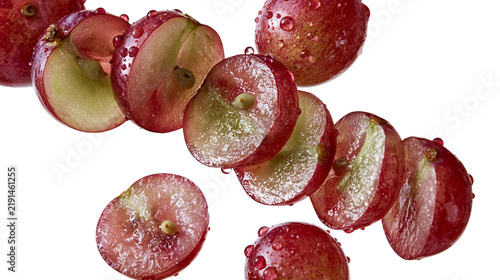 Fotografie Fresh sliced red grapes with water droplets