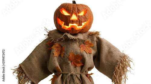 Fotografía Scary glowing jack-o-lantern pumpkin head on a burlap scarecrow body with leaves