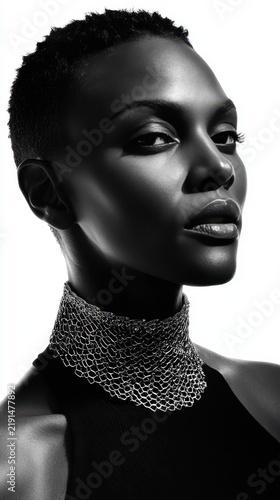 Black and White African Female Fashion Model Monochrome Portrait in Stylish Outfit and Elegant Necklace Jewelry Pose. Fictional Character Created by Generative AI.