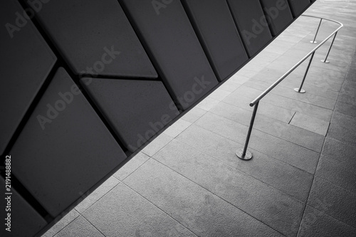 Strong diagonal composition with geometric facade and minimalist railing. Black and white horizontal showing