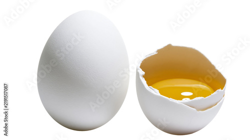 Canvastavla Whole white chicken egg and broken eggshell with raw yolk inside