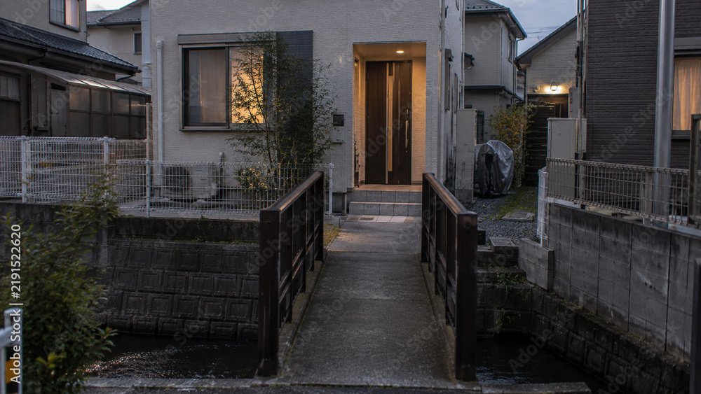 Fototapeta premium Modern Japanese House with a Small Canal in a Quiet Neighborhood