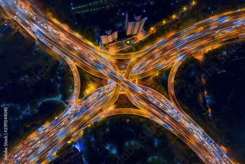 Фотография Aerial View of Busy Highway Interchange with Light Trails at Night