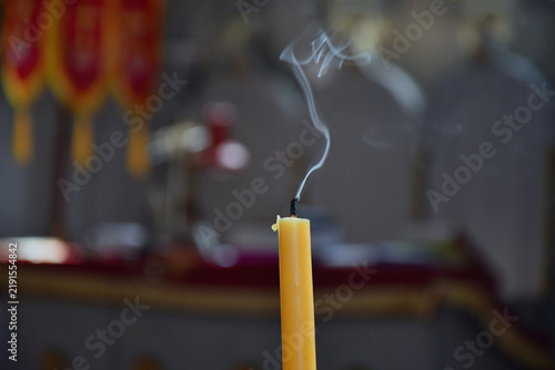 Canvas Print Burnt out candle closeup in a church