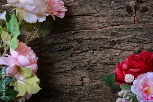 Canvastavla artificial flowers in a frame on a wooden table with copy space