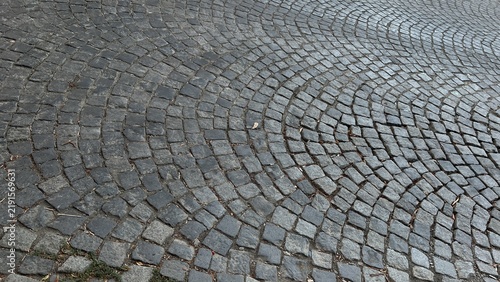 Fotografie Vintage cobblestone pavement texture with wavy pattern on city street