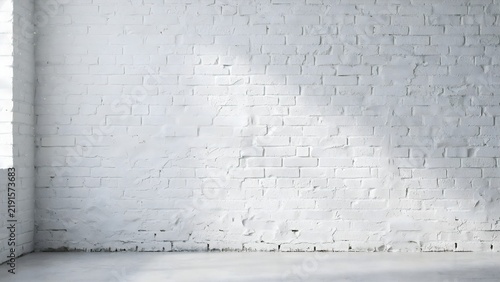 Empty interior room with white painted brick wall and concrete floor