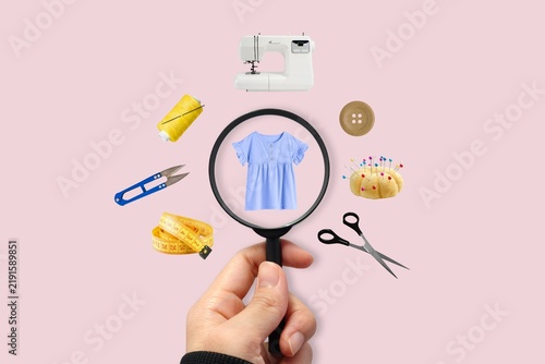 Принти на полотні Sewing tools with a magnifying glass showing a dress design