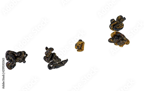 Levitating tea leaves isolated on a white background