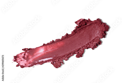 Wine red lipstick smudge on pale