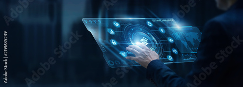 Obraz na płótnie Businessman analyzing Software development and code repository framework data on digital screen. Programming language architecture, agile software release, bug fixes, system engineering.