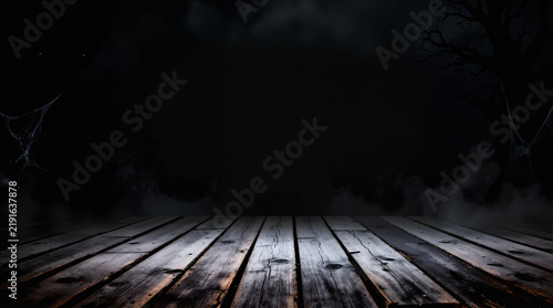 Spooky halloween background with empty wooden planks, dark horror background. Celebration theme, copyspace for text. Ideal for product placement
