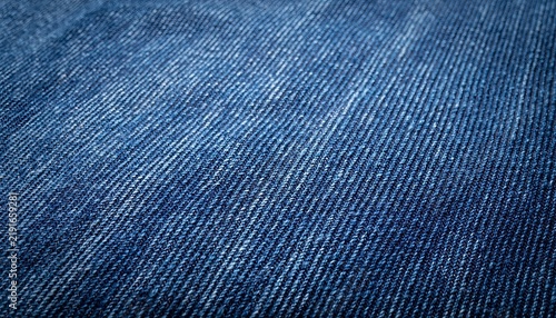 Denim Fabric Texture: A close-up view reveals the intricate diagonal weave and classic blue hue of a textured denim fabric, highlighting its durable and versatile nature.