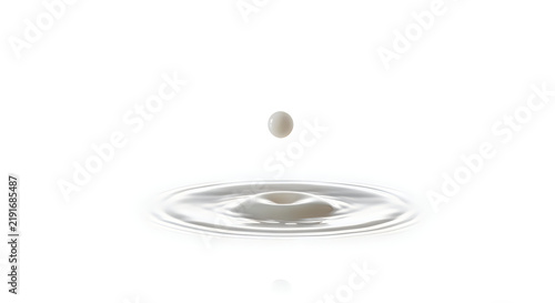 A single white milk droplet falling into a liquid surface creating ripple circles in isolated white background