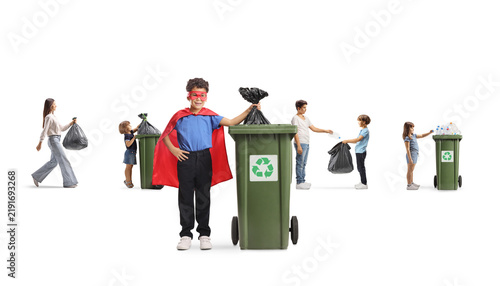 Children recycling plastic bottles and throwing waste in bins