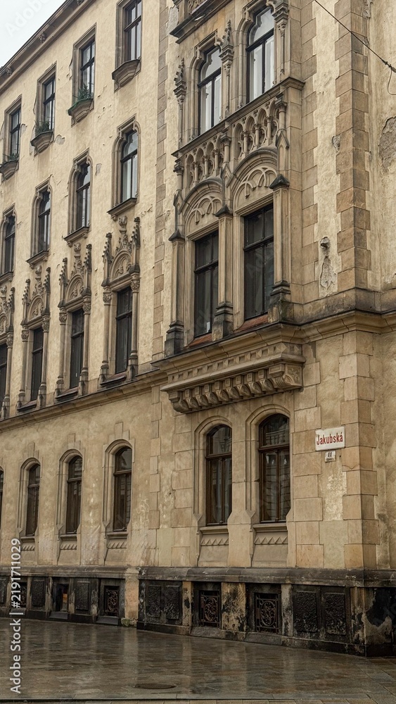 Fototapeta premium Architectural detail of ancient gothic building facade on a rainy day in Prague, Czech Republic 
