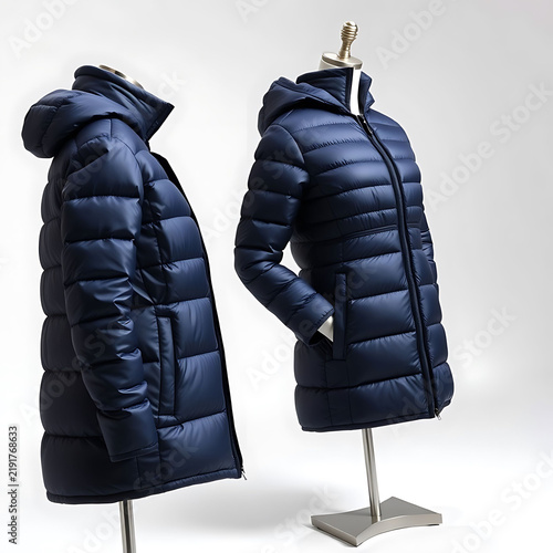 Two blue quilted puffer jackets with hoods displayed on professional store mannequins