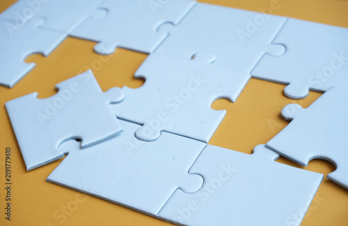 Bild auf Leinwand An incomplete puzzle, with some pieces missing, symbolizes incompleteness, imperfection, mystery, or loss