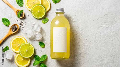 Glass Bottle Lemonade Packaging Mockup on Textured Surface
