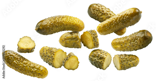 Group of pickled cucumbers and slices on a white background. The file contains a clipping paths.